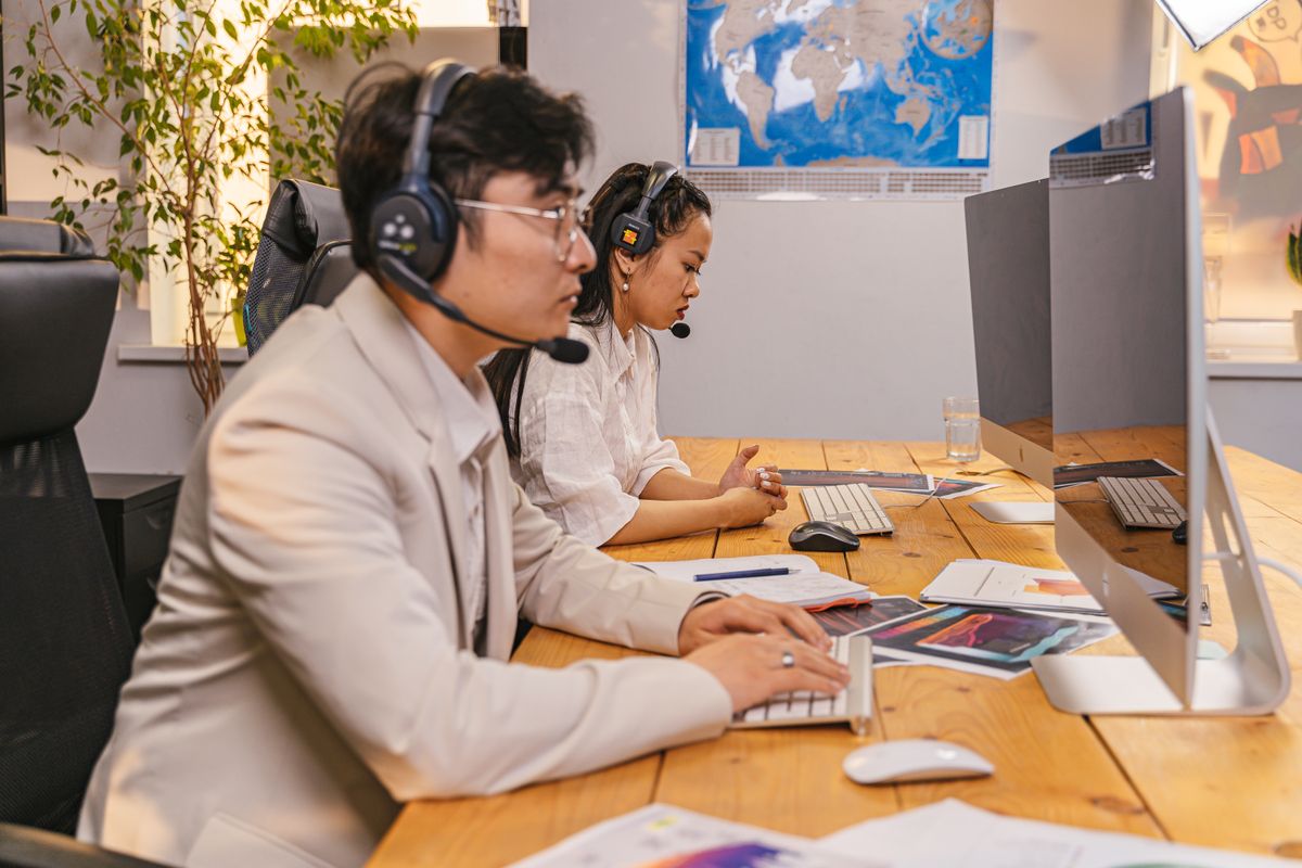 Two colleagues reviewing work together