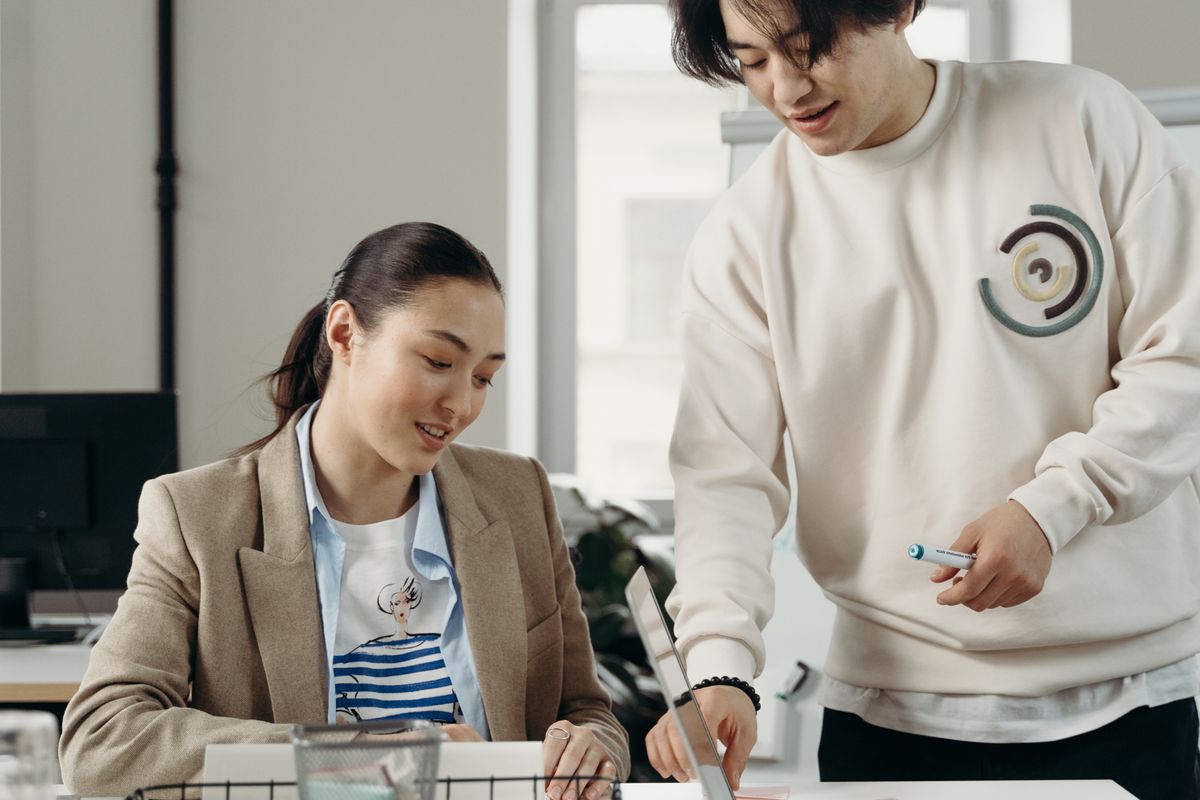Colleagues working together at a computer